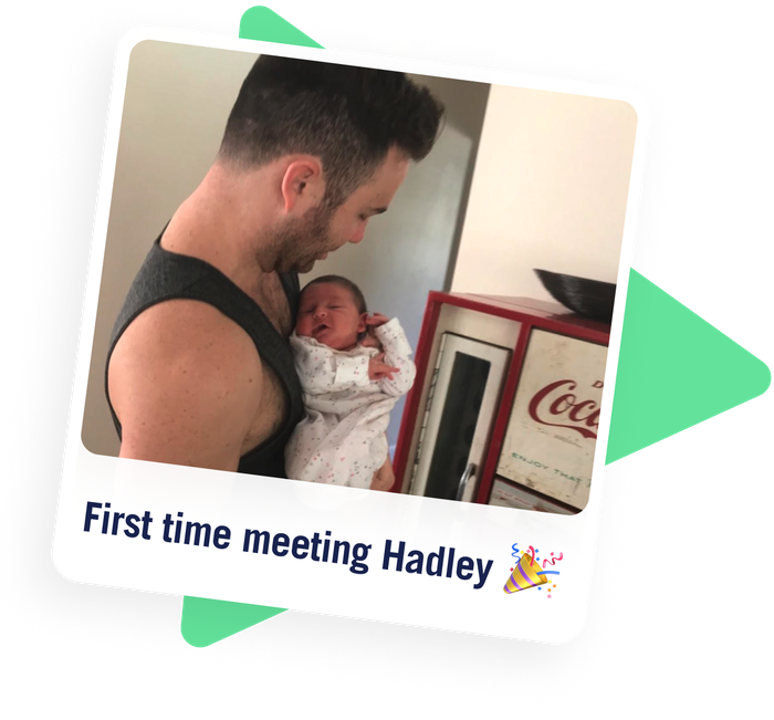A photo of a man holding a baby labeled: First time meeting Hadley
